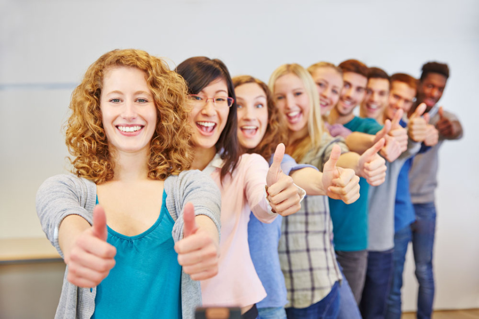 Many teenager in a row holding thumbs up for congratulation